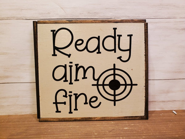Ready aim fire ." 6X6 wooden sign
